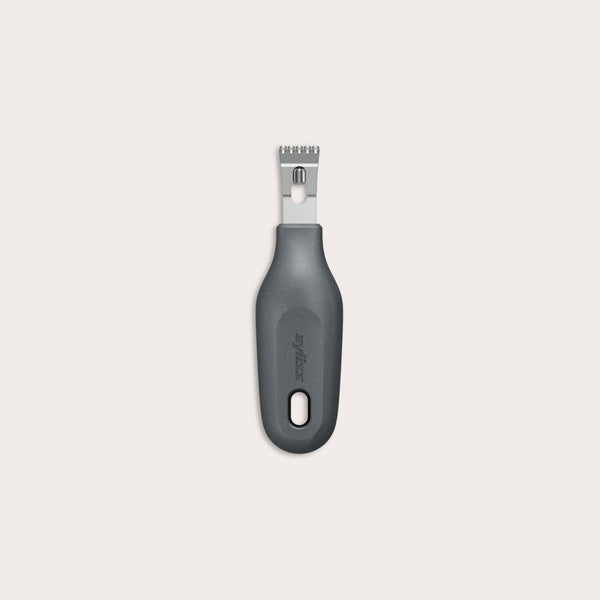 The Zyliss 2-In-1 Zester, made of stainless steel with a black ergonomic handle and a hole at the base, is an eco-friendly kitchen tool shown against a plain light background. 