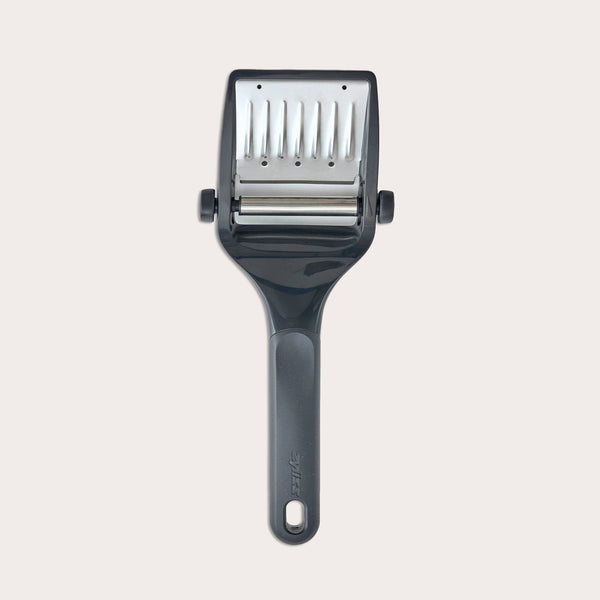 The Zyliss Utility Cheese Plane features an adjustable black and silver handle with sharp stainless steel blades for fast slicing, and it's dishwasher safe for easy cleaning.
