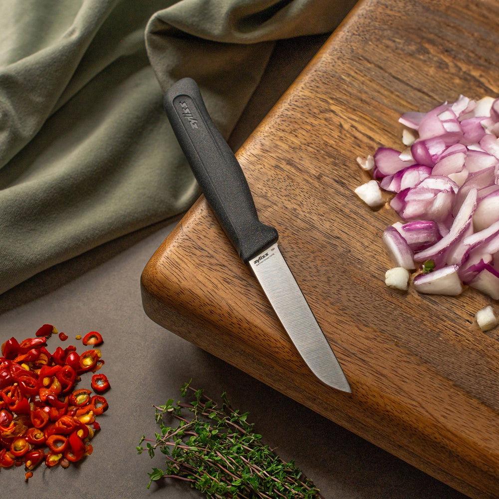 The Zyliss Vegetable Knife 9cm (3½) features a straight, narrow silver blade and a dark gray eco-friendly handle, ideal for precision cutting, shown on a plain light background. 