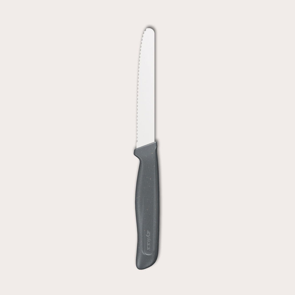 The Zyliss Tomato Knife Serrated 11cm / 4½ features a silver serrated blade and an eco-friendly handle, shown against a plain white background. 