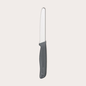 The Zyliss Tomato Knife Serrated 11cm / 4½ features a silver serrated blade and an eco-friendly handle, shown against a plain white background. 