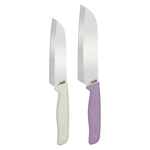 The Zyliss Classic 2 Piece Santoku Knife Set features two stainless steel knives with wide blades—one with a white textured handle and the other with a purple textured handle—standing upright side by side on a white background.