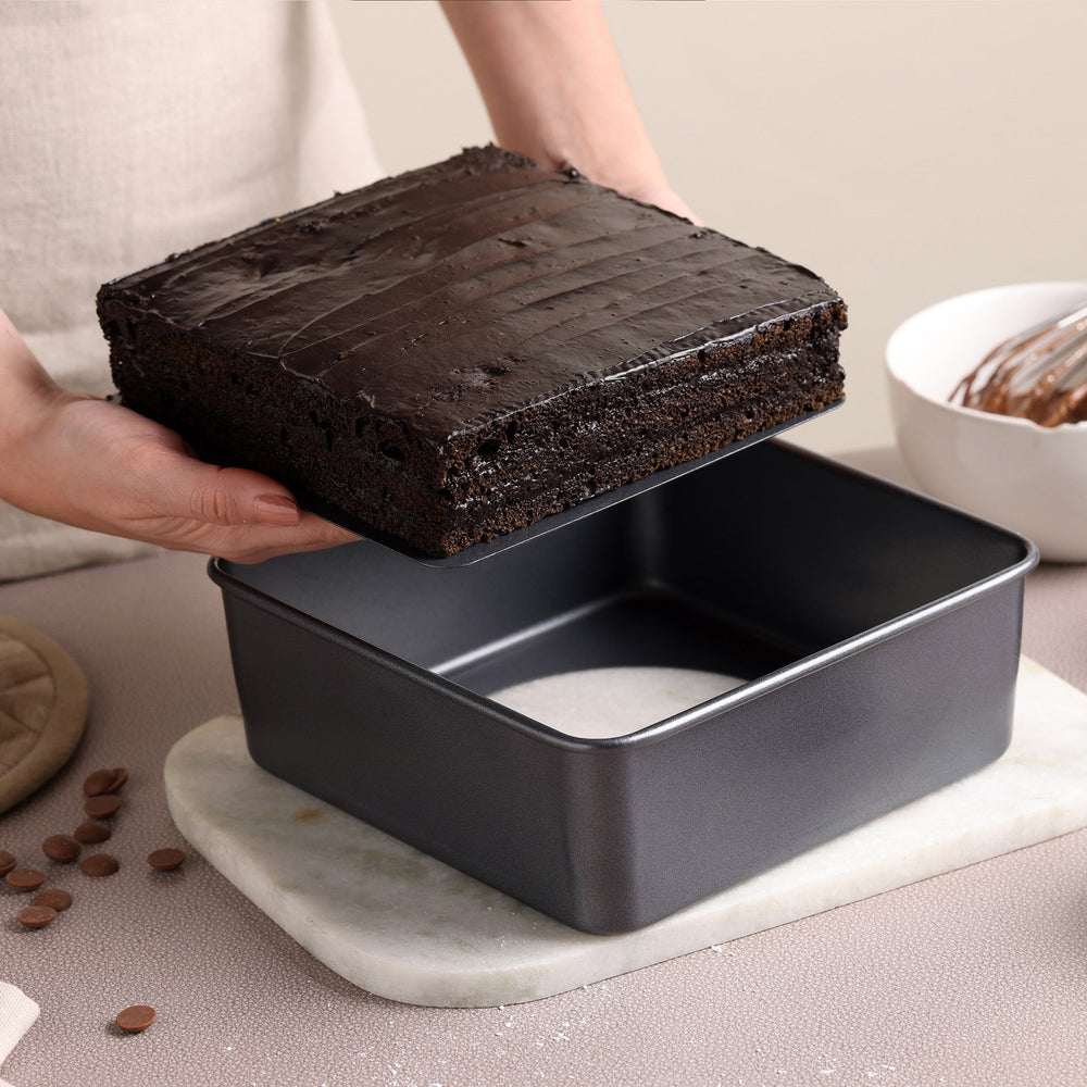 The Zyliss Non-Stick Base Square Pan 20cm/8" in black carbon steel with high sides is shown on a light background.