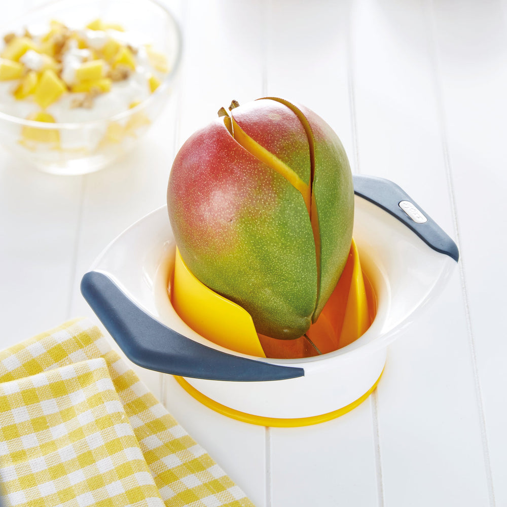 A yellow and white Zyliss Mango Splitter with non-slip handles and stainless steel blades, designed for easily slicing and coring mangoes, is shown on a light background. 